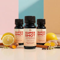 Três frascos do Super Shot Pod com limão, cúrcuma, gengibre e canela